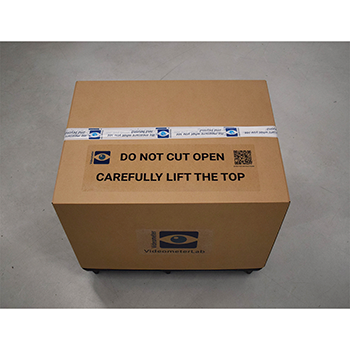 Crate with the wrap and securing strips removed